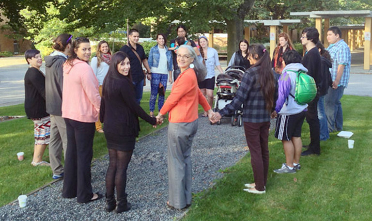 Okanagan students and staff gather in a prayer circle prior to attending the Truth and Reconciliation Commission’s national event in Vancouver. Photo credit: Patty Wellborn